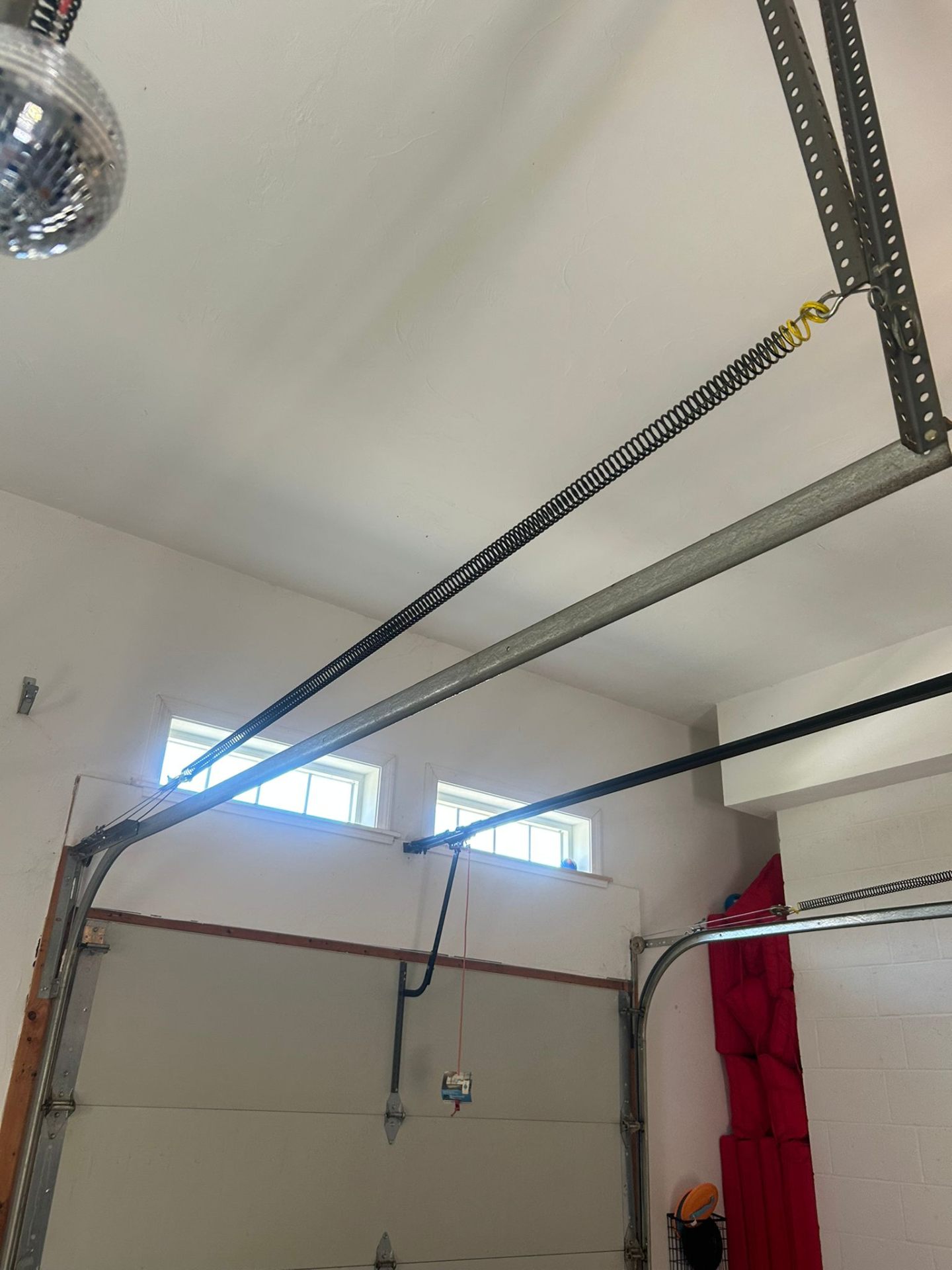 Garage door track and spring repair after coming off track