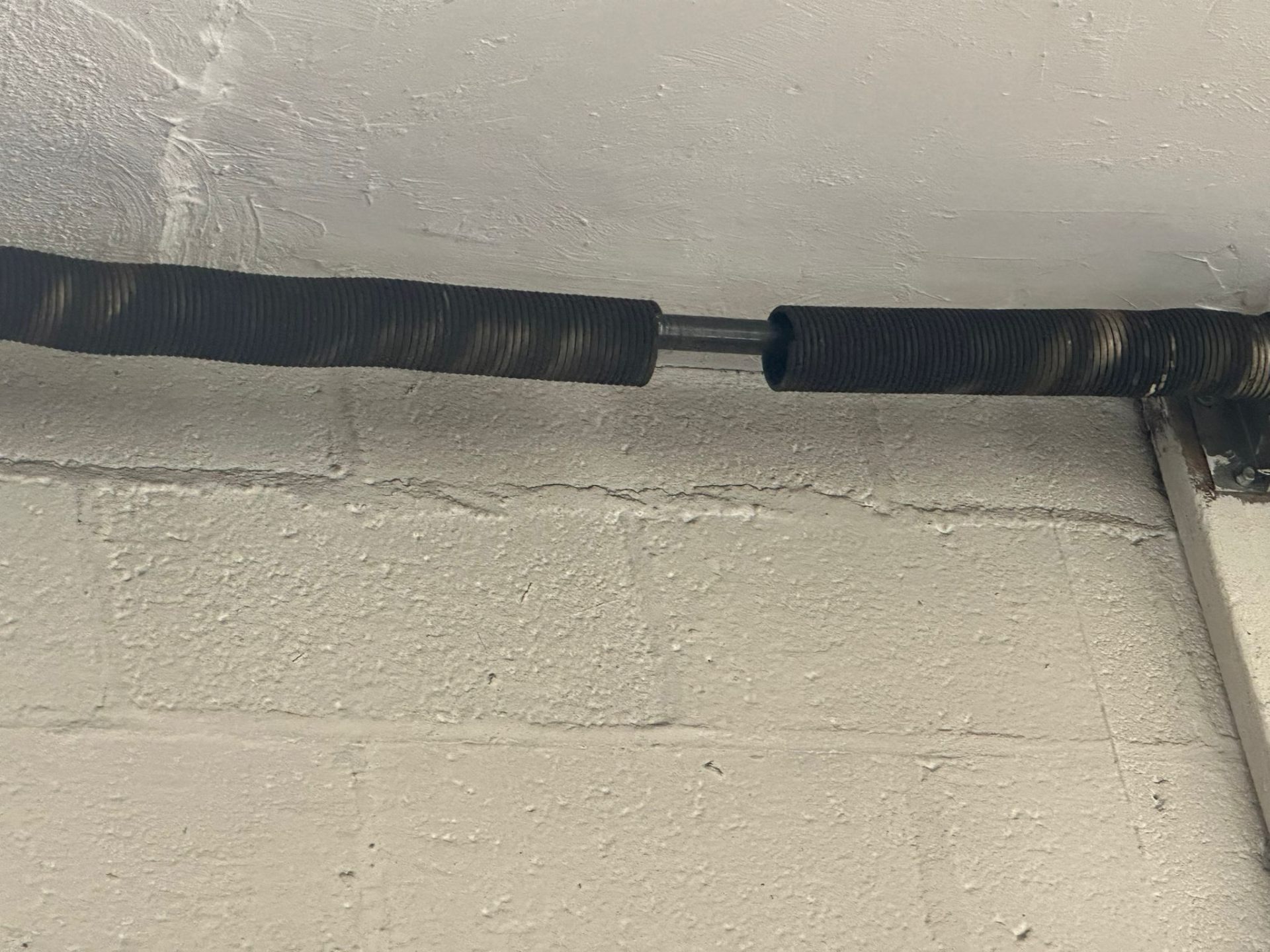 Broken torsion spring replaced on a residential garage door